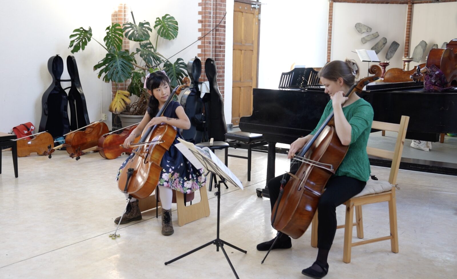 Cello students in a group lesson