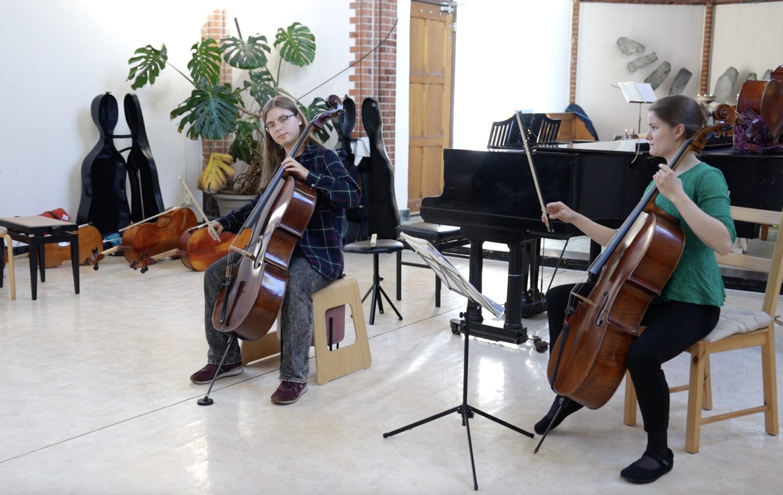 Cellists performing